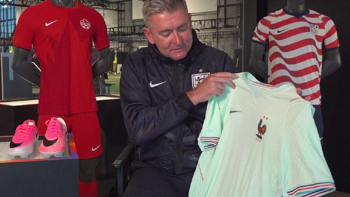 Phil McCartney, chief innovation, design and product officer for Nike, holds up the away jersey for France that the company designed for the World Cup during an interview at Nike headquarters in Beaverton, Ore., on June 22, 2026.