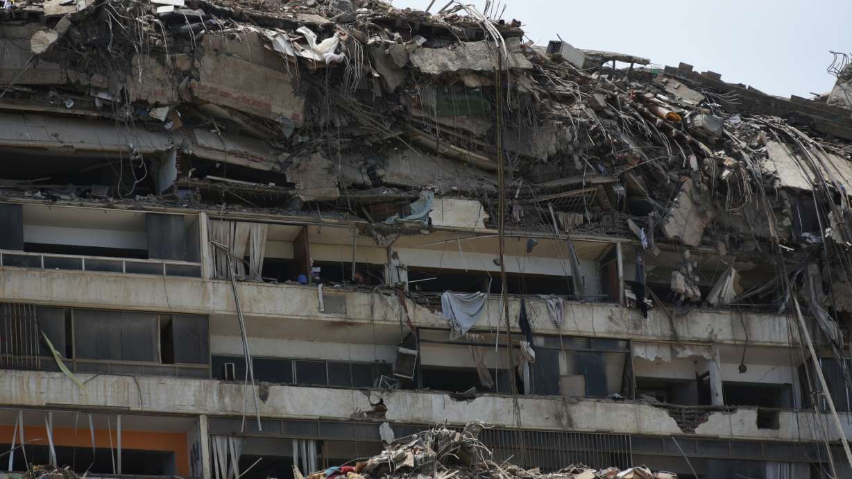 Damaged buildings stand in Catia La Mar, Venezuela, a day after an earthquake and several aftershocks struck the city, Thursday. The death toll from the disaster now stands at 589.