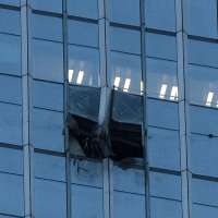 Small aircraft crashes into Beijing's tallest building, eyewitnesses say
