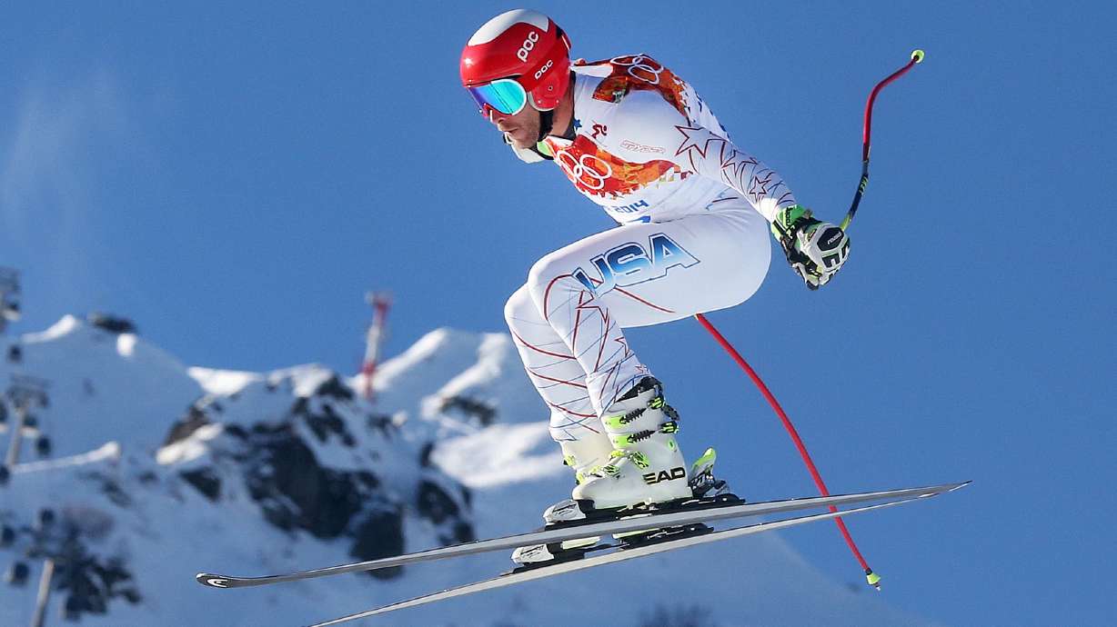FILE - United States' Bode Miller makes a jump during men's downhill combined training at the Sochi 2014 Winter Olympics, Feb. 13, 2014, in Krasnaya Polyana, Russia.