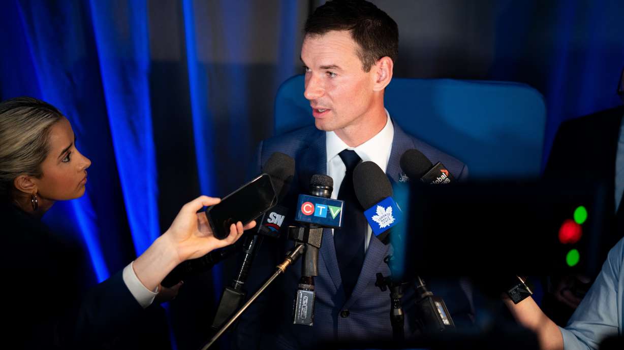 FILE - New Toronto Maple Leafs General Manager John Chayka speaks during a scrum following a news conference in Toronto, May 4, 2026.