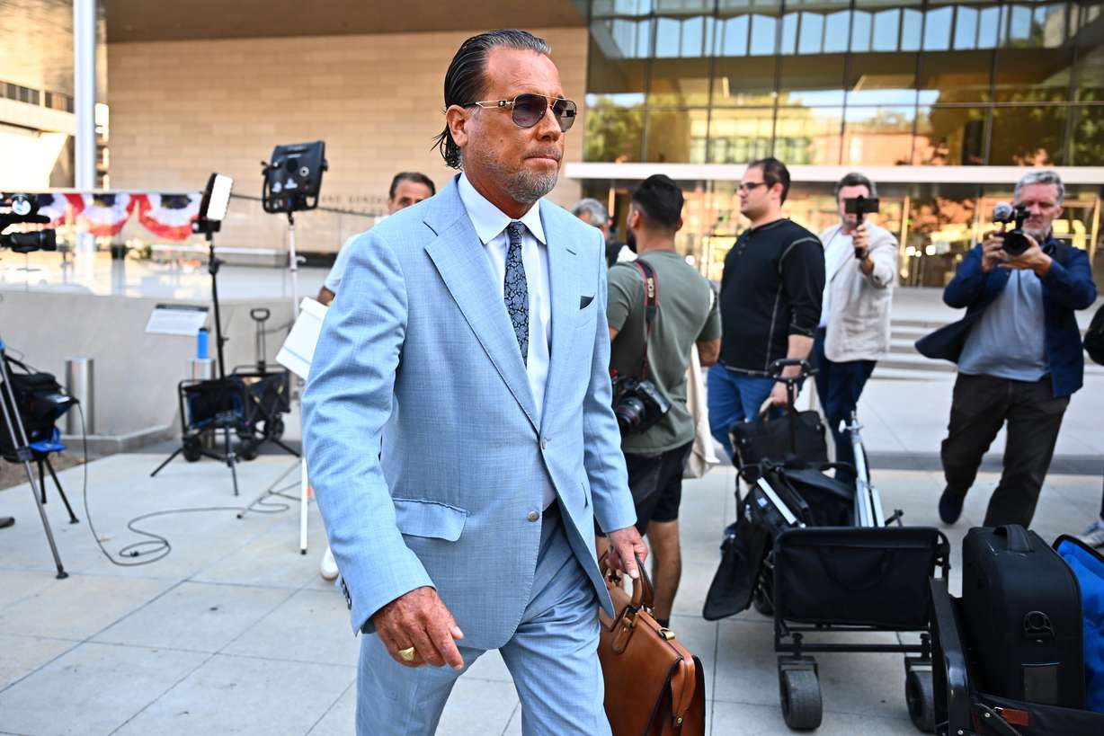 Steve Haney, attorney for Jonathan Rinderknecht, leaves after speaking at a news conference outside federal court, Thursday, in Los Angeles. Haney said the mistrial result on Friday shows Rinderknecht is innocent.