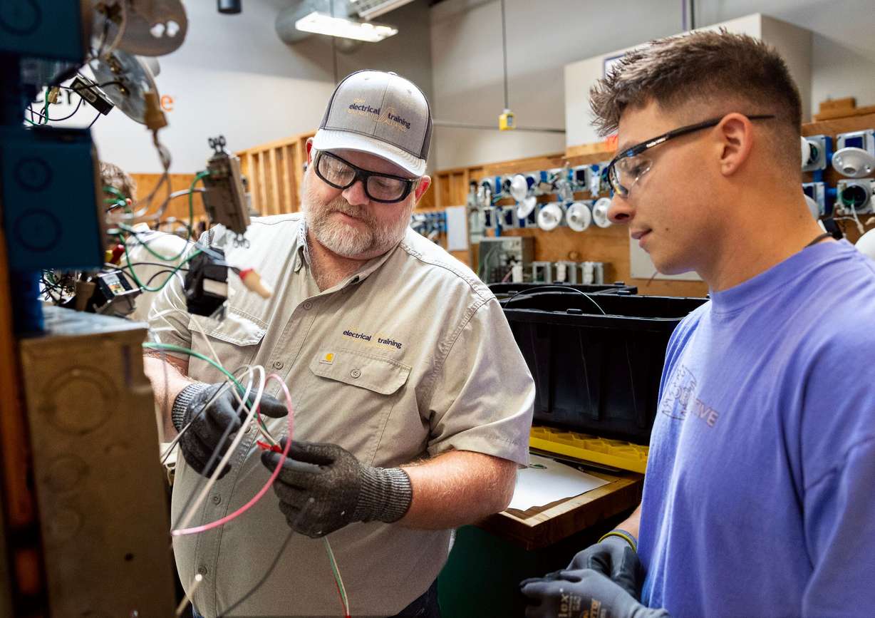 Instructor Jake Sill works with Colton Hatch at the Utah Technical Training Alliance in West Jordan on Friday. Rep. Burgess Owens touted apprenticeships like this in a House subcommittee meeting on Wednesday.