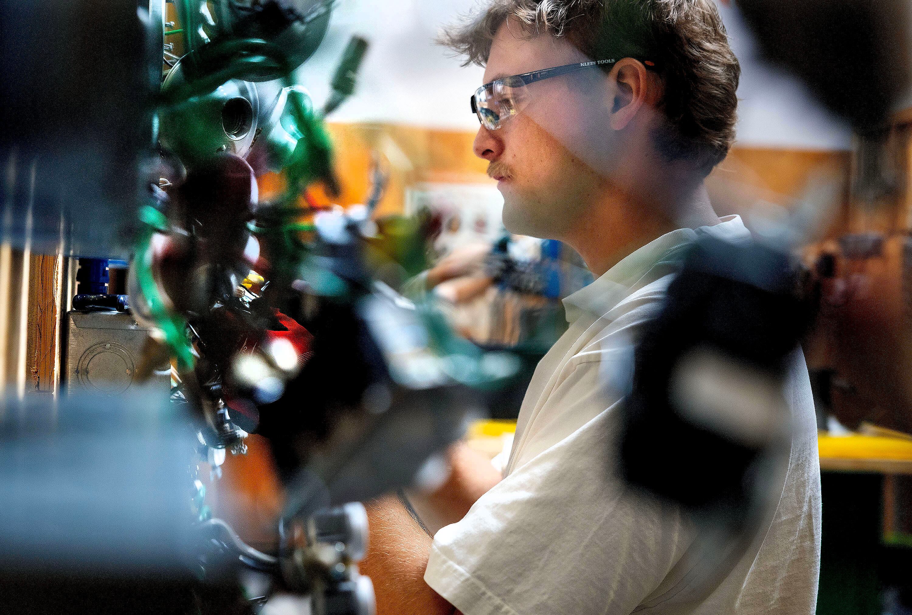 Tanner Low practices hooking up switches to lights at the Utah Technical Training Alliance in West Jordan on Friday. Jamie Angell cautioned that one should choose college or trade because of their goals and vision for their future.