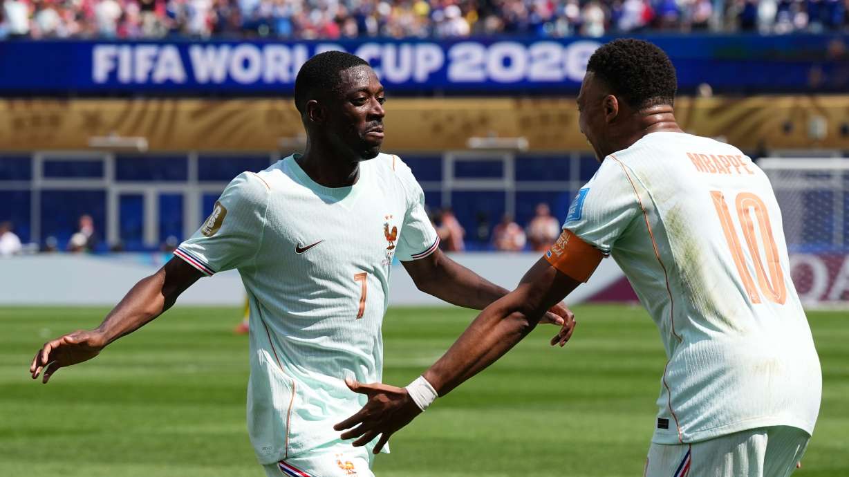 France's Ousmane Dembele celebrates with Kylian Mbappe, right, after scoring his side's third goal during the World Cup Group I soccer match between Norway and France in Foxborough, Mass., near Boston, Friday, June 26, 2026.