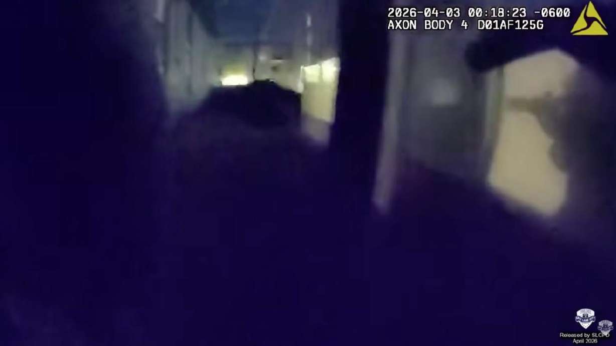 Police-worn body camera footage shows a SWAT team rolling up to an apartment complex during the execution of a search warrant in Salt Lake City. During the search, an officer fired a gun toward a window and injured a 37-year-old man, who was taken into custody. On Friday, Utah's district attorney announced the officer who fired shots was cleared of any charges in the shooting.