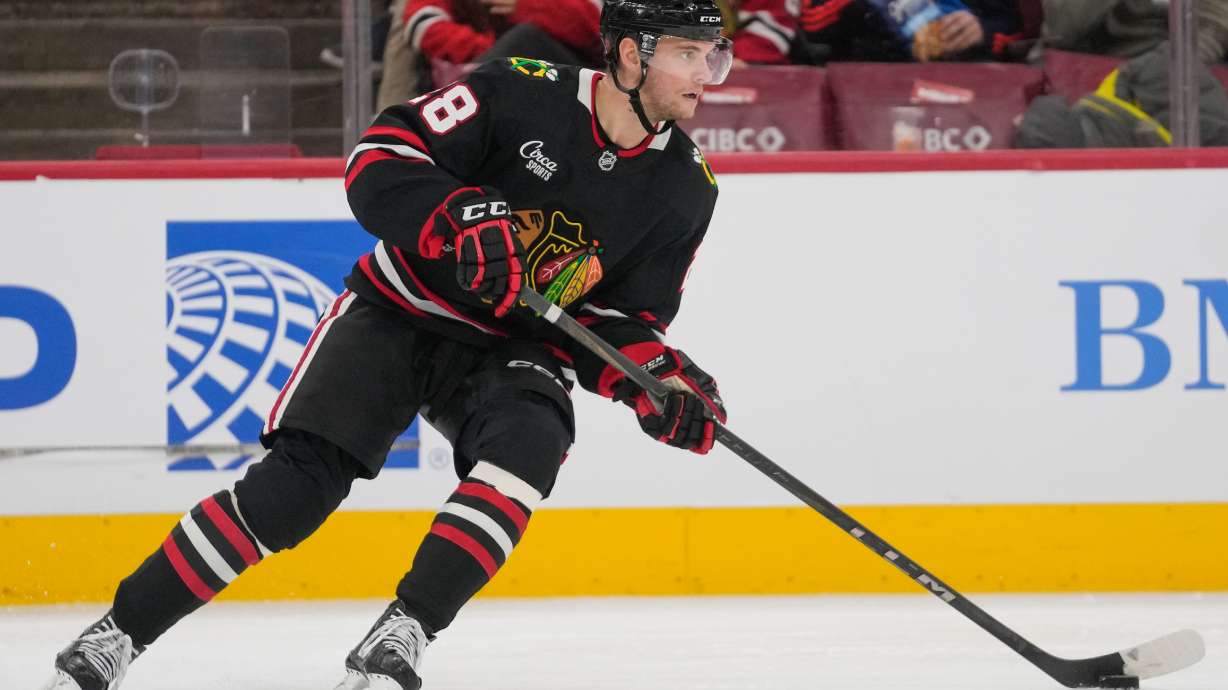 FILE - Chicago Blackhawks left wing Andre Burakovsky controls the puck during the second period of an NHL hockey game against the Washington Capitals, Jan. 9, 2026, in Chicago.