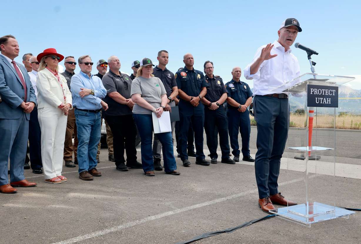 Gov. Spencer Cox speaks at a press conference about current wildfire conditions near the Bonneville Fire burn scar in Salt Lake City on Thursday.