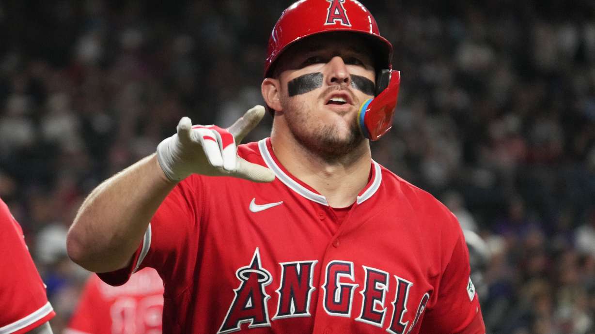 Los Angeles Angels' Mike Trout (27) reacts after hitting a two-run home run against the Arizona Diamondbacks in the fifth inning of a baseball game, Tuesday, June 16, 2026, in Phoenix.