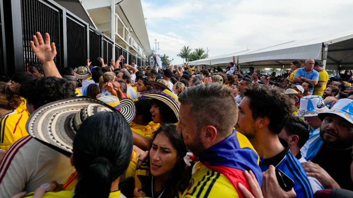 FILE - Fans wait to enter the stadium prior to the Copa America final soccer match between Argentina and Colombia in Miami Gardens, Fla., July 14, 2024.