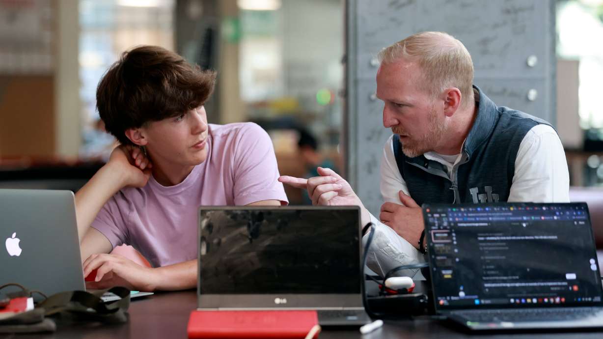 Maddox Liechty gets advice from Scott Holley, Lassonde Entrepreneur Institute executive director, at Lassonde Startup Academy at the University of Utah on Monday. The U. has the best odds of producing "unicorn" business founders, a Stanford business professor said.