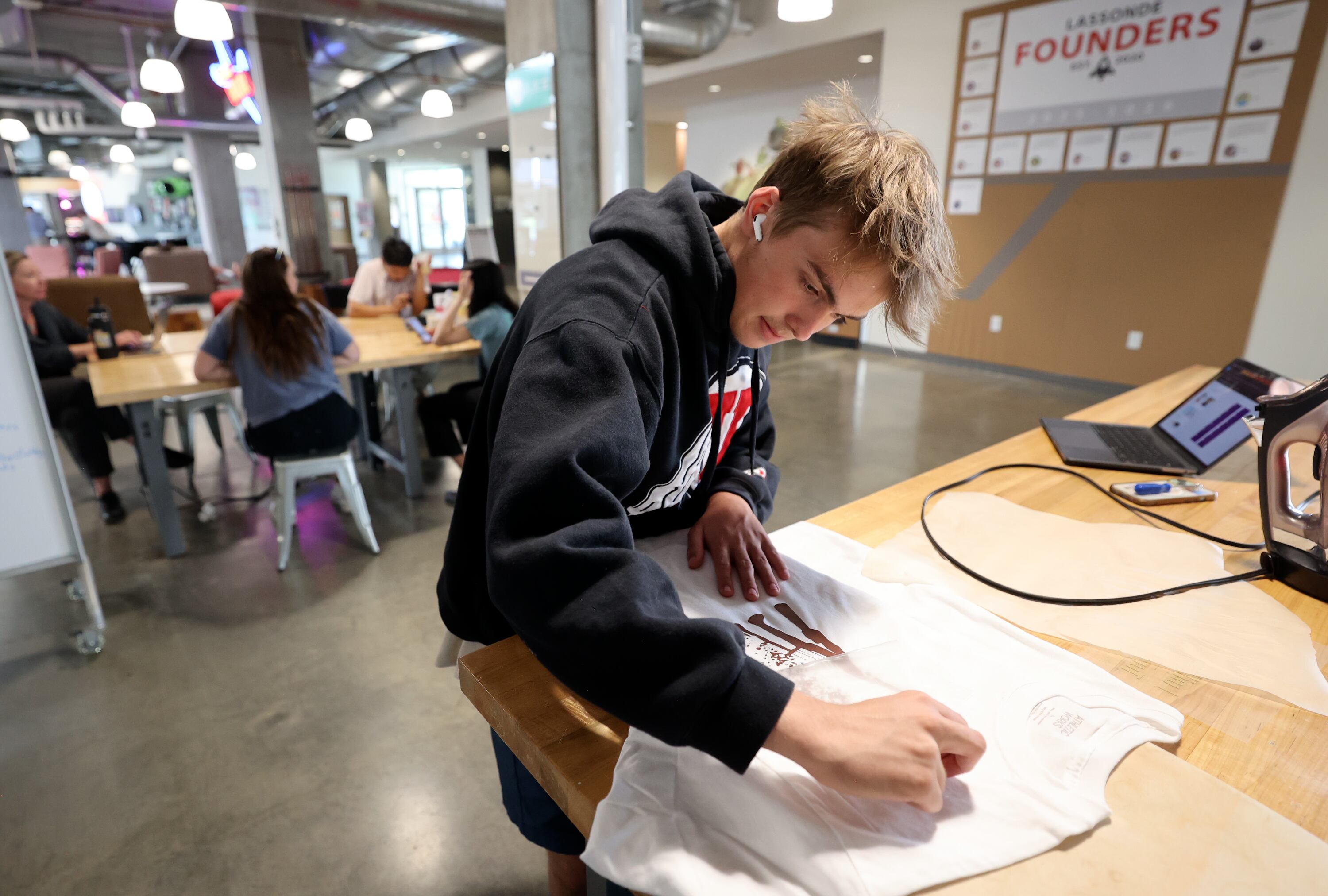 Luke Burton, 16, of St. George, makes a custom T-shirt for his company aloofshirts.com at Lassonde Startup Academy at the University of Utah’s Lassonde Studios in Salt Lake City on Monday. A Stanford business professor said U. students have the greatest odds to create "unicorn" businesses.