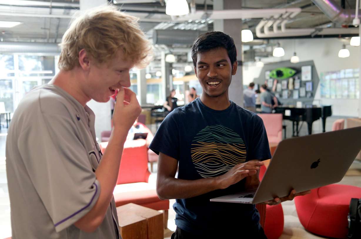 Cooper Marshall, teaching assistant, helps Sashwath Narayana, 17, of Herriman, with CAD design of interchangeable footwear soles during Lassonde Startup Academy at the University of Utah’s Lassonde Studios in Salt Lake City on Monday. Many have taken their maiden steps into creating their own businesses at Lassonde.