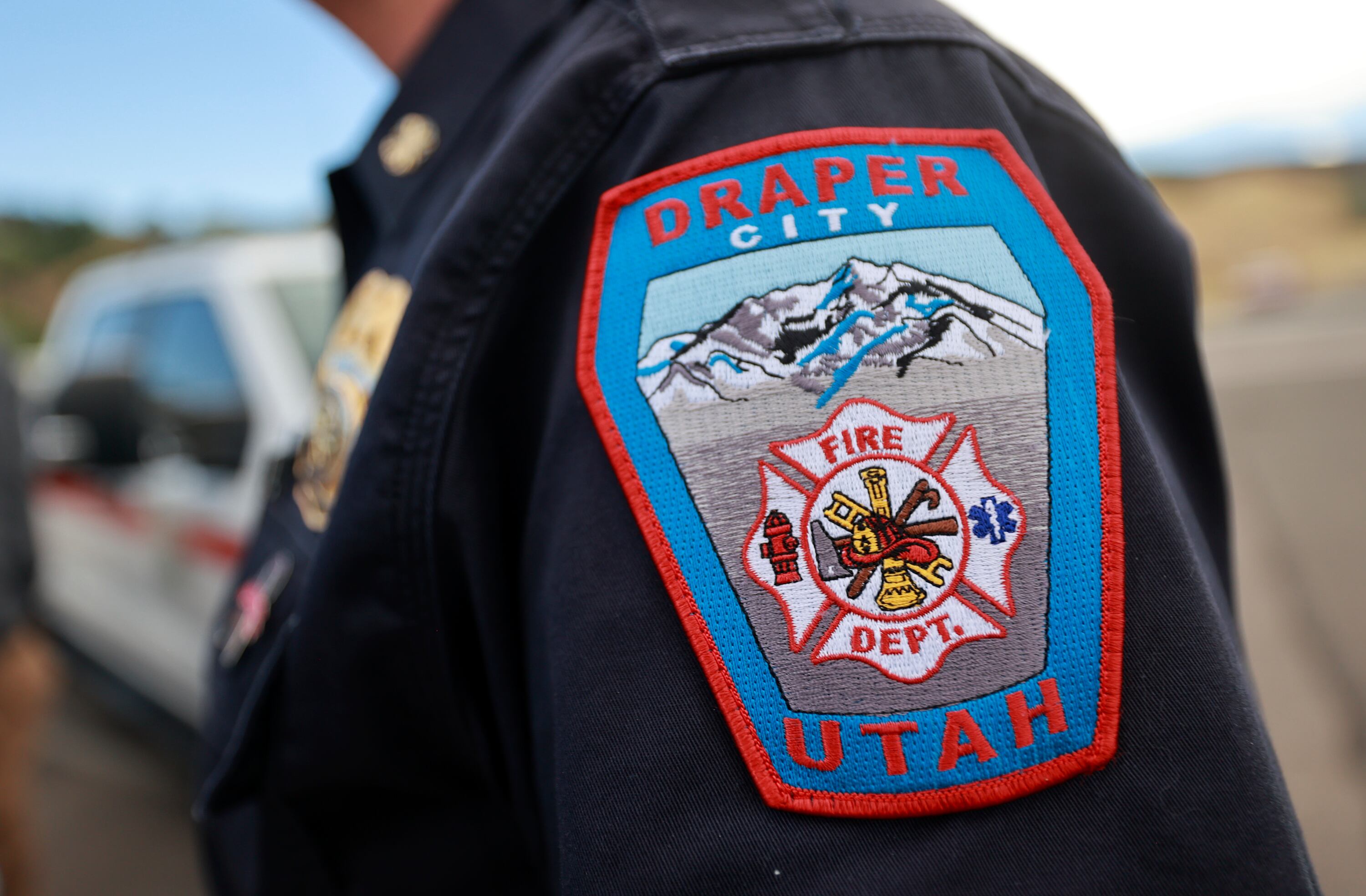 A Draper City Fire patch is pictured during a press conference about current wildfire conditions near the Bonneville Fire burn scar in Salt Lake City on Thursday, June 25, 2026.