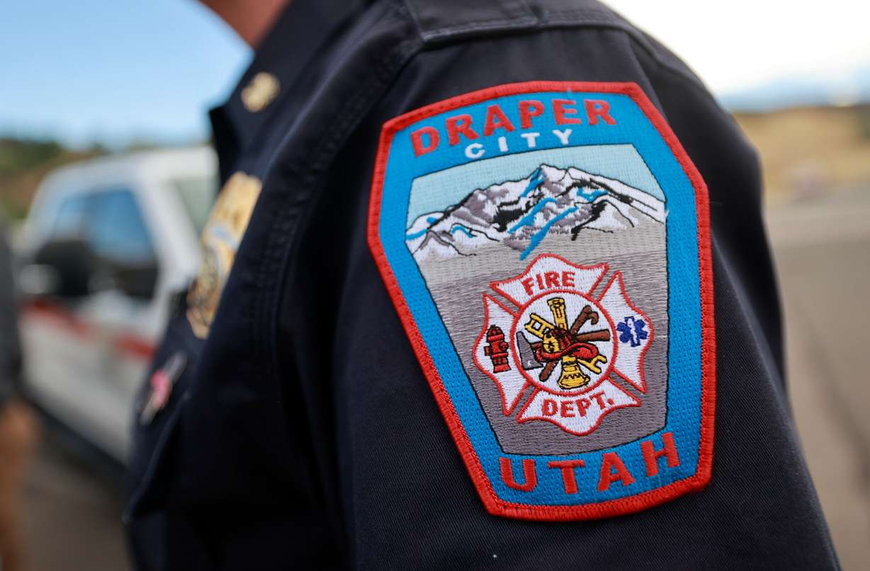 A Draper City Fire patch is pictured during a press conference about current wildfire conditions near the Bonneville Fire burn scar in Salt Lake City on Thursday, June 25, 2026.