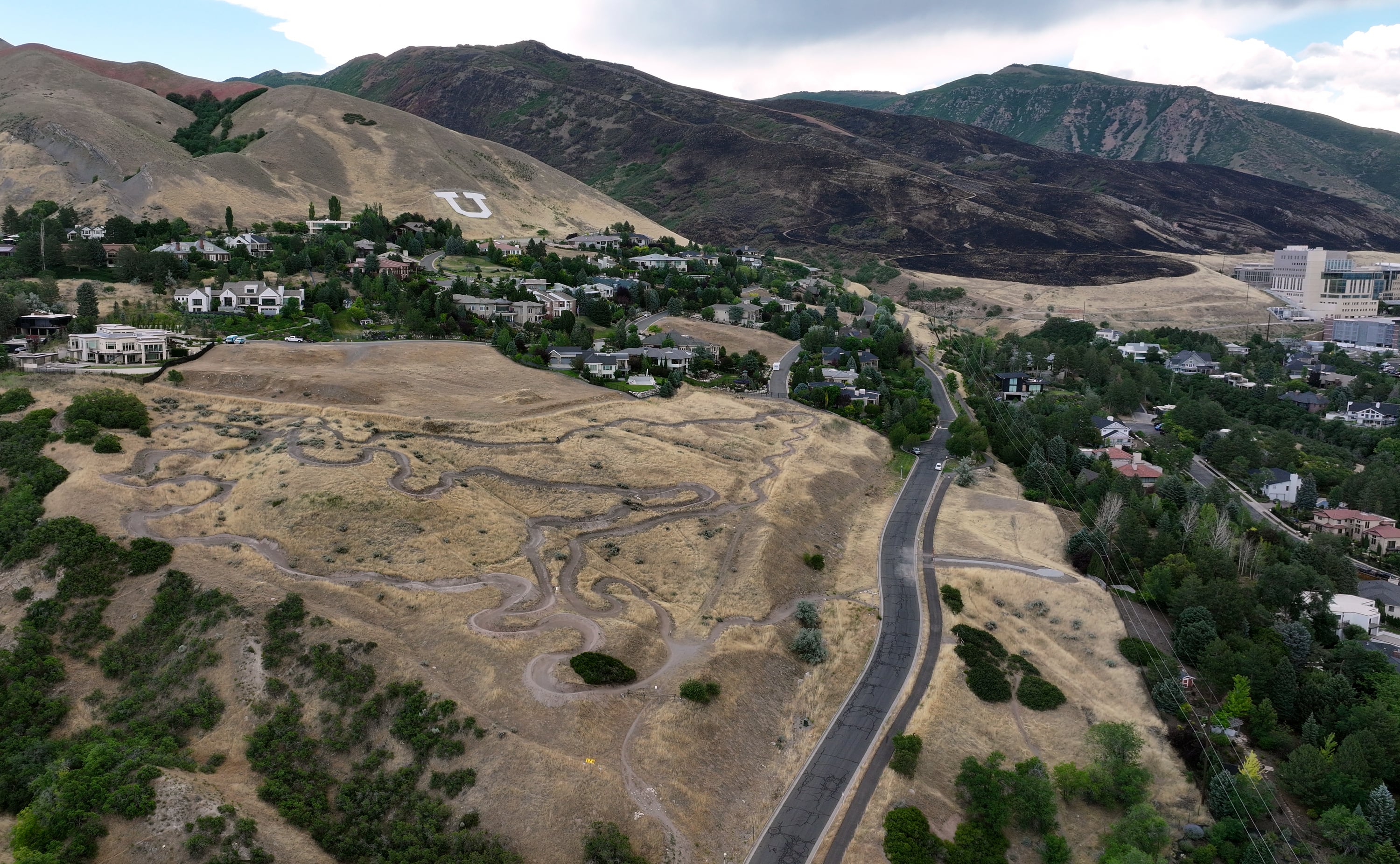 A parched hillside is pictured next to the Bonneville Fire burn scar in Salt Lake City on Thursday, June 25, 2026.
