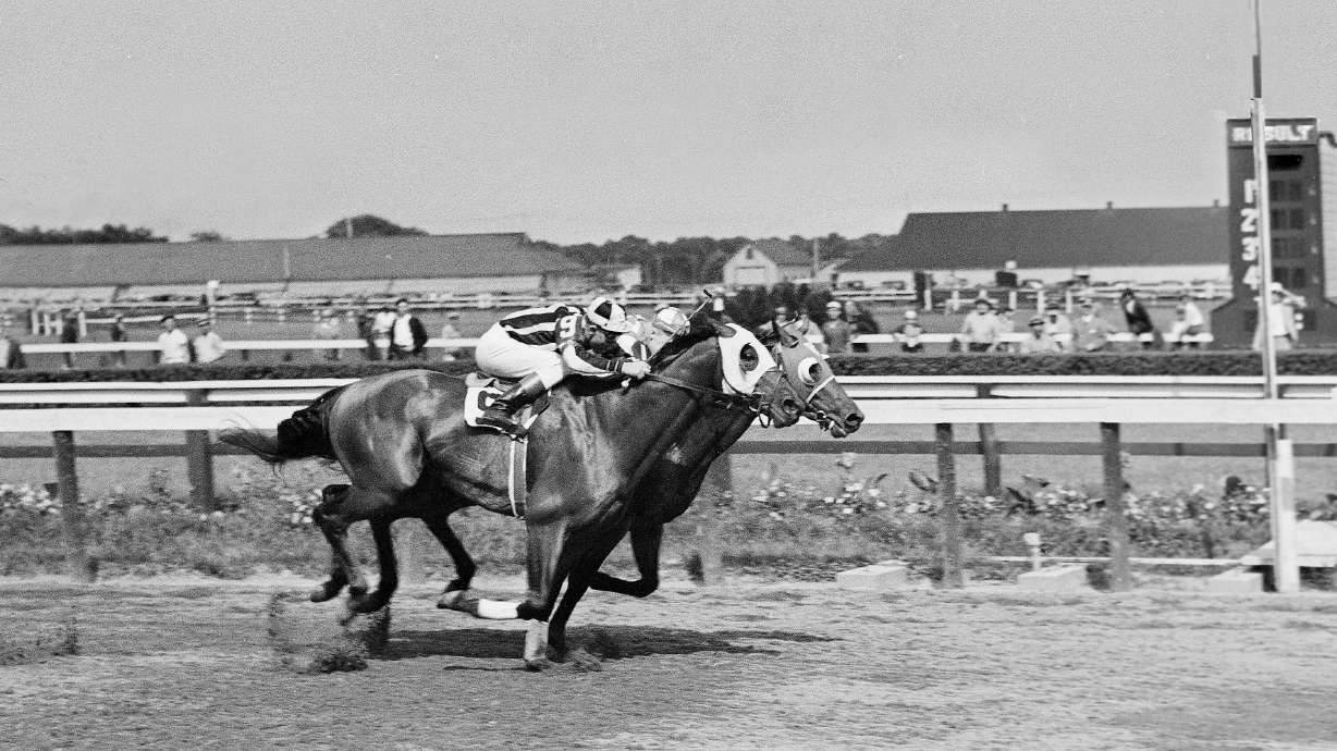 FILE - Seabiscuit leads local horse Aneroid by a nose in the Brooklyn Handicap at the Aqueduct race track in New York on June 26, 1937.