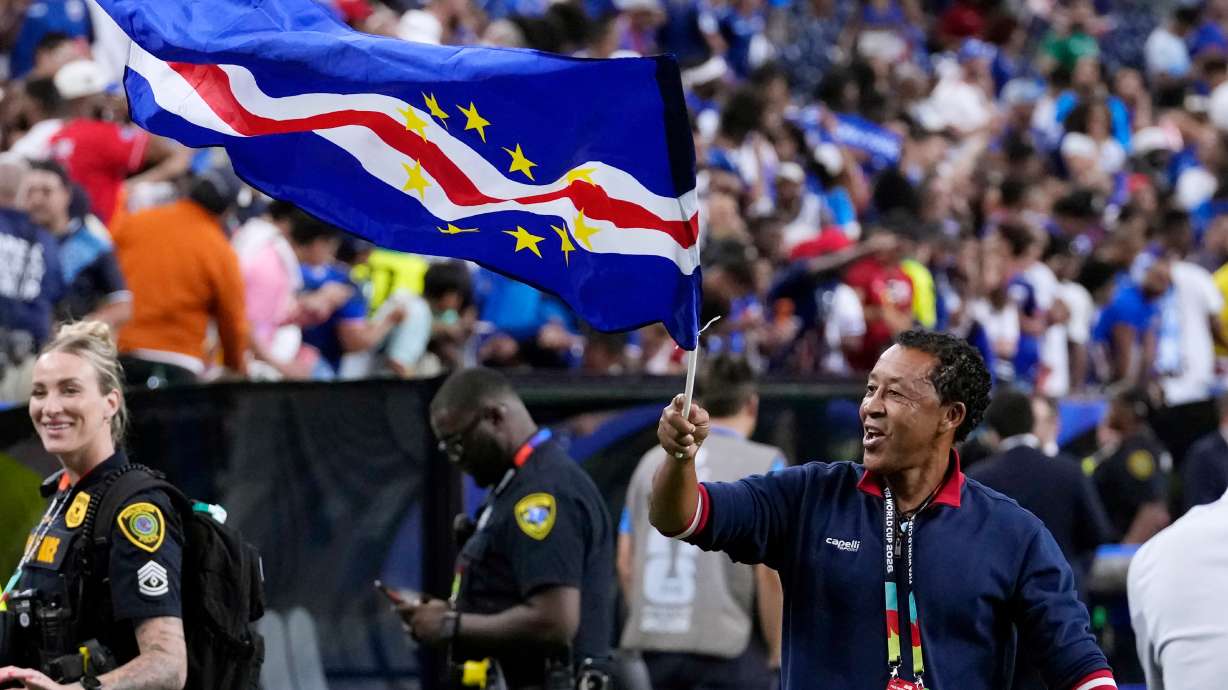 Cape Verde head coach Bubista waves the flag as he celebrates with fans after their 0-0 draw against Saudi Arabia after the World Cup Group H soccer match in Houston, Friday, June 26, 2026.