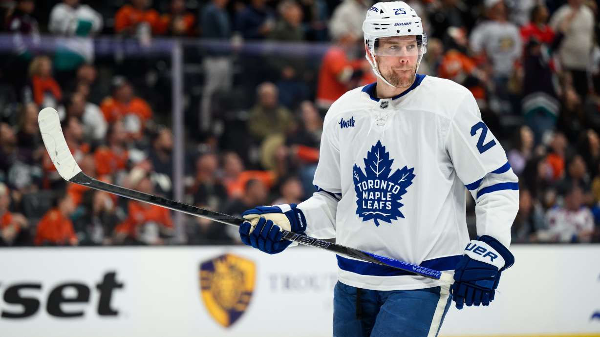 FILE - Toronto Maple Leafs defenseman Brandon Carlo looks on during the first period of an NHL hockey game against the Anaheim Ducks, March 30, 2026, in Anaheim, Calif.
