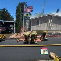 Firefighters respond to fire that spread to 5 homes