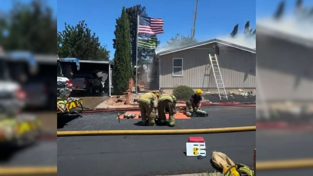 Firefighters respond to a fire that spread to five homes in St. George on Saturday.