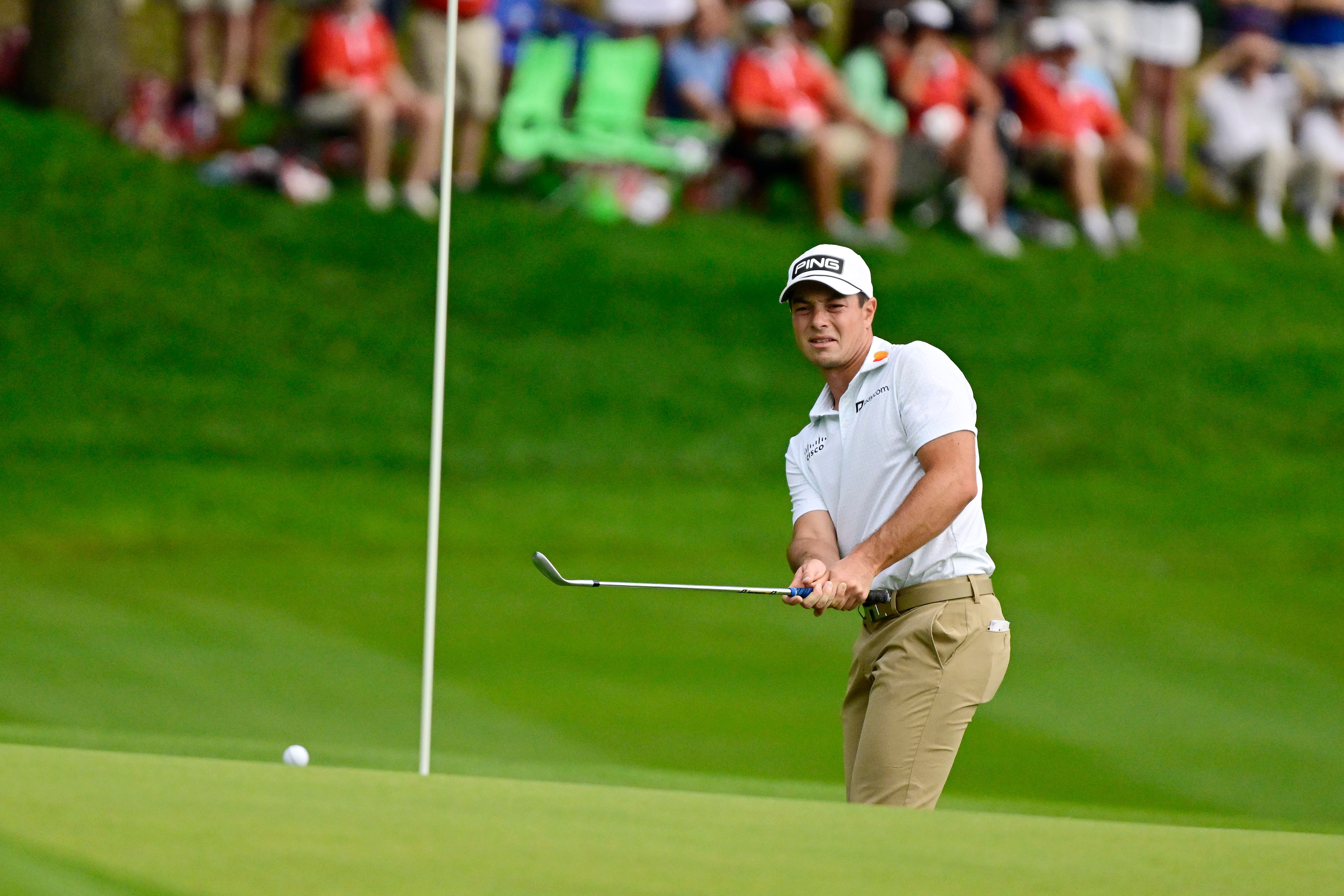 Viktor Hovland, of Norway, watches his shot land near the pin on the 15th green during the third round of the Travelers Championship golf tournament at TPC River Highlands, Saturday, June 27, 2026, in Cromwell, Conn. 
