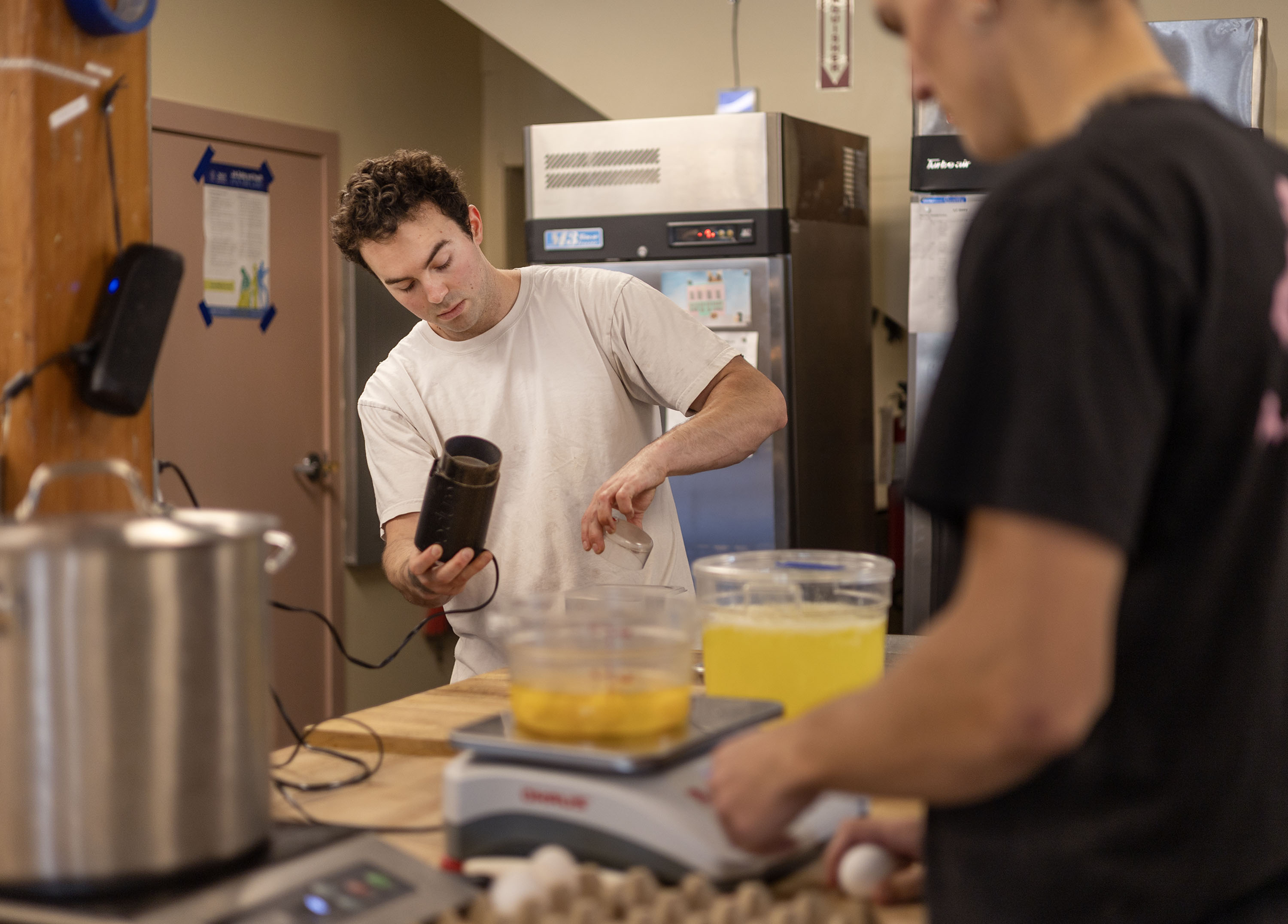 Eli Fuhrman, owner of All Purpose Bakehouse, works with Theo Zimmer at All Purpose Bakehouse in Salt Lake City on Wednesday. Fuhrman said travel has a huge impact on his baking.