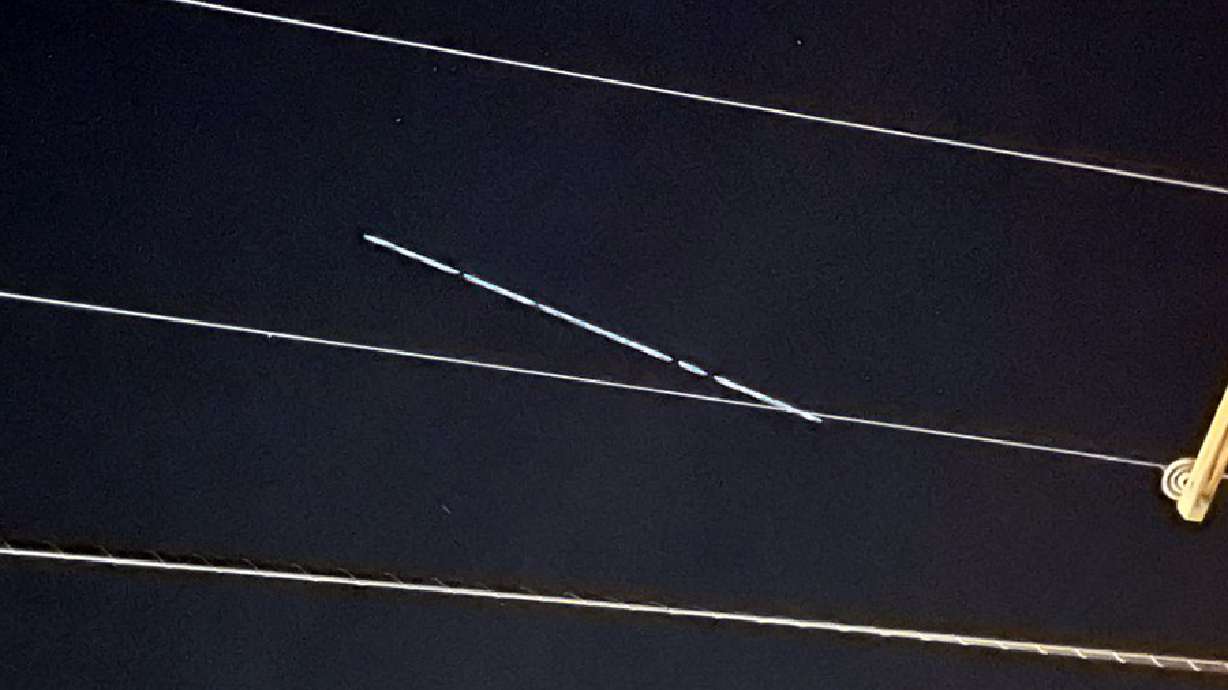 Starlink satellites pass over Utah, creating bright line across the sky
