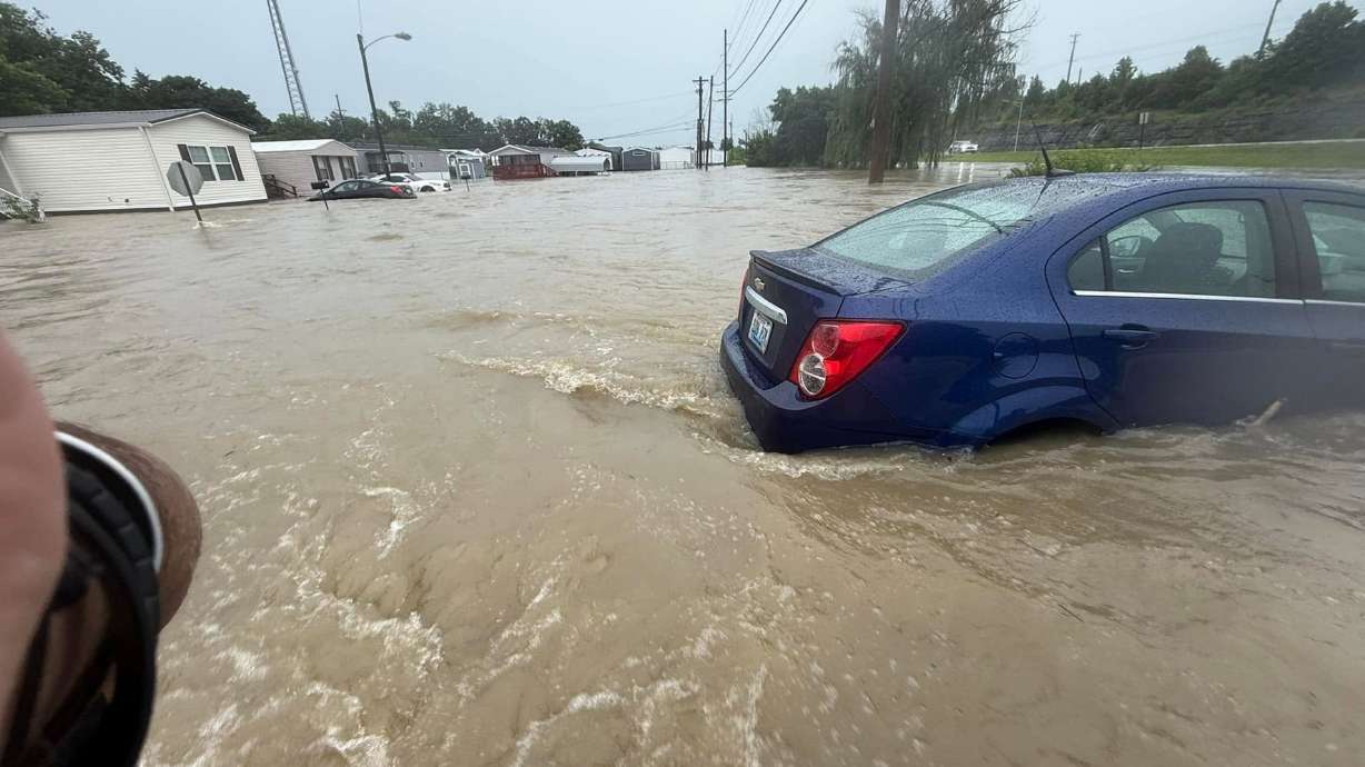 Floodwaters cover roads in Richmond, Ky., on Saturday, where emergency responders have performed water rescues and blocked off flooded roadways.
