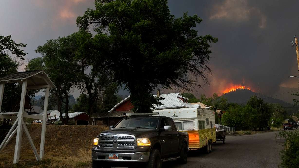 Residents rush to evacuate as winds drive the Iron Fire toward Eureka on Saturday. On Sunday, the evacuation order was lifted and residents were allowed to return home.