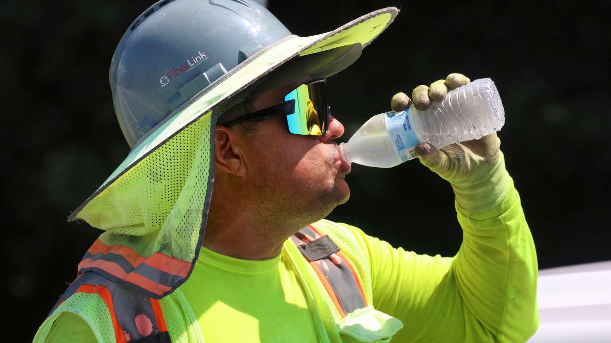 Fiber optic worker Hareberto Cruz cools off during a break at an installation project on S.R. 434 at S.R. 417 in Winter Springs, Fla., as afternoon temperatures hit the high 90s, July 28, 2025. A heat wave and high humidity are expected to hit much of the eastern U.S. this week.