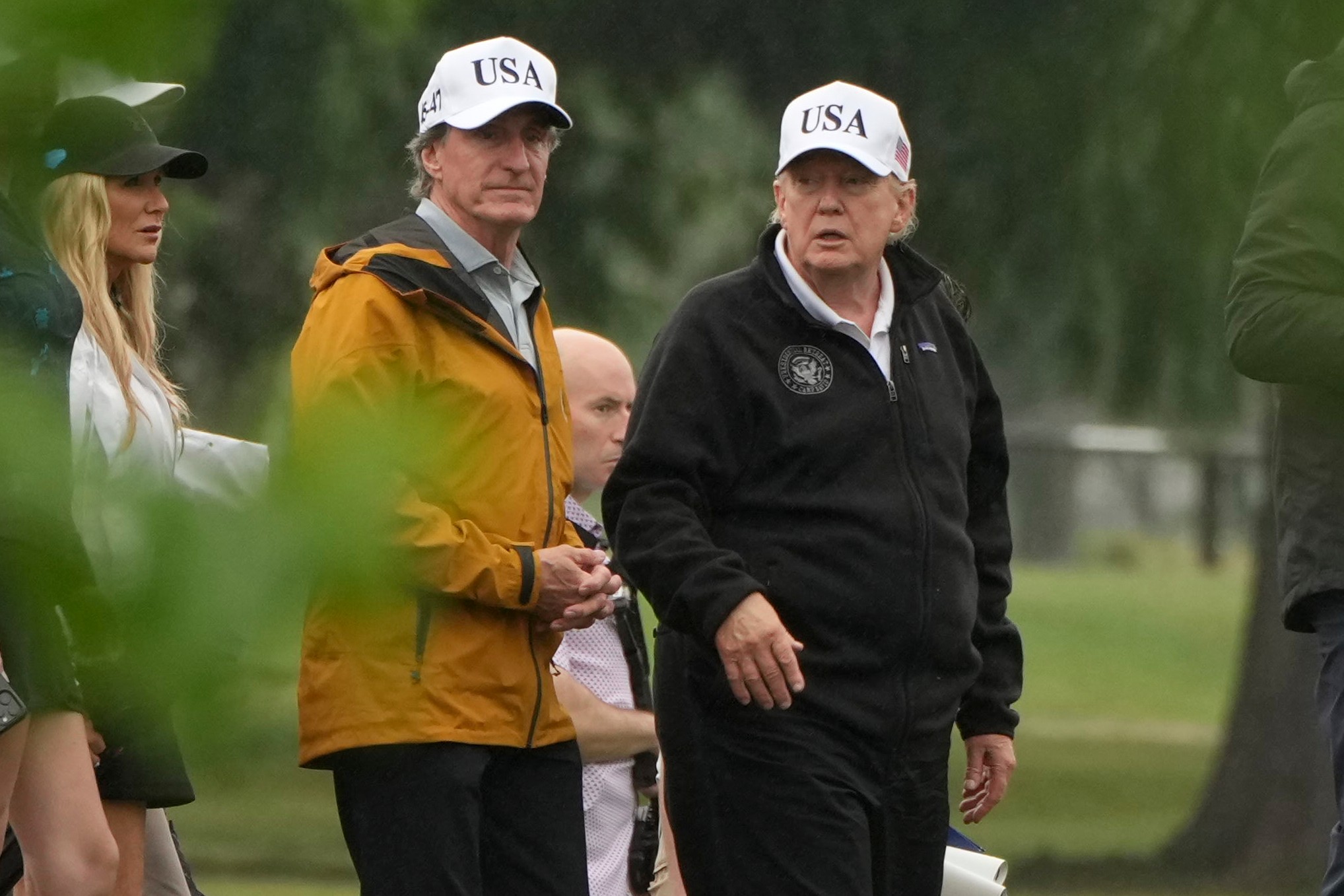 President Donald Trump, from right, and Interior Secretary Doug Burgum tour the East Potomac Park golf course, Sunday, June 28, 2026, in Washington. 