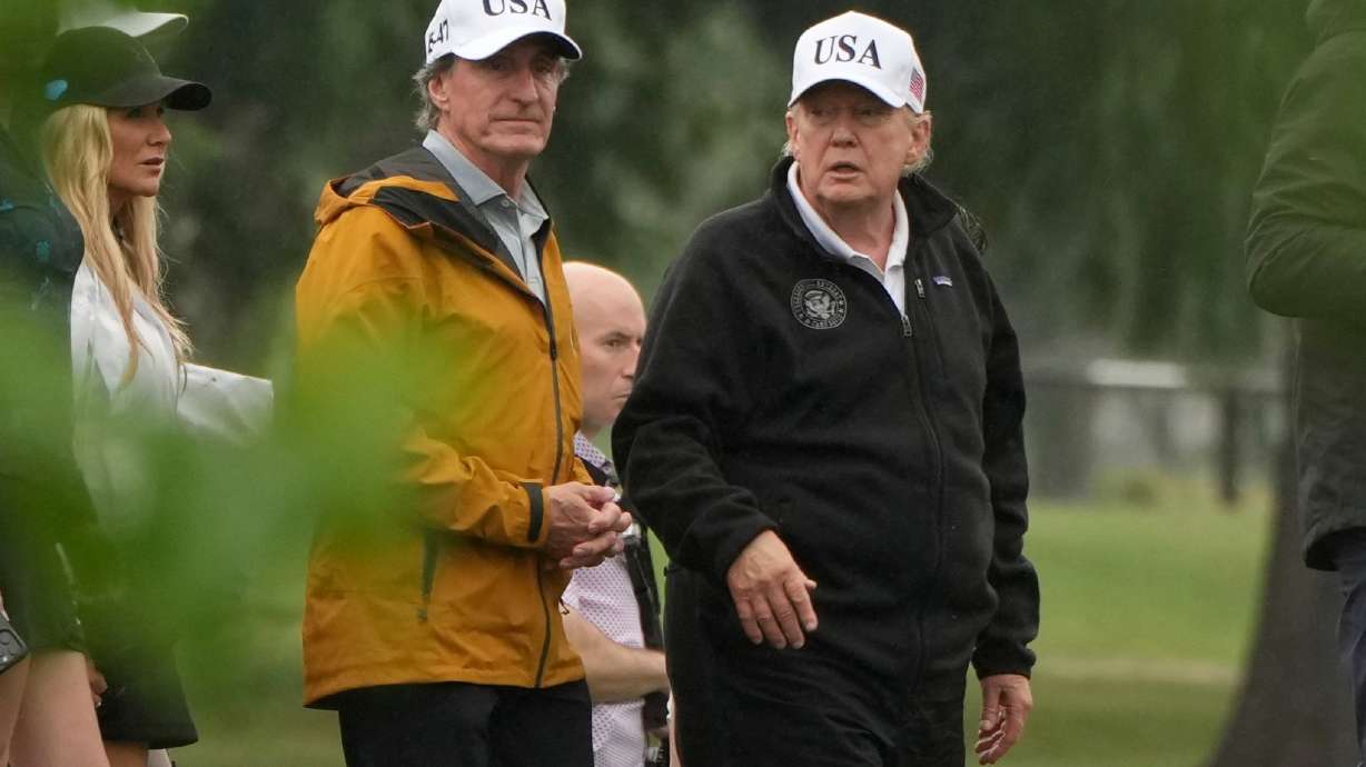 President Donald Trump, from right, and Interior Secretary Doug Burgum tour the East Potomac Park golf course, Sunday, June 28, 2026, in Washington.
