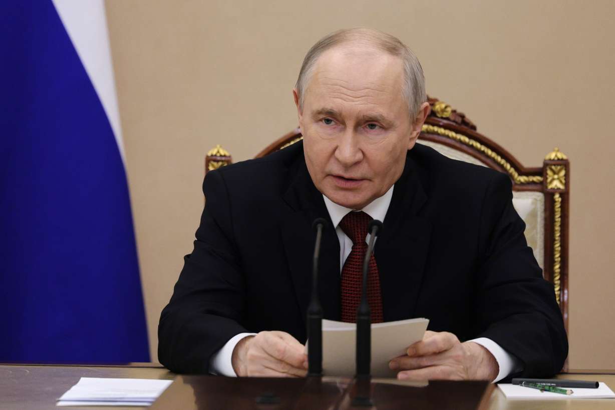Russian President Vladimir Putin chairs a meeting on domestic fuel supplies at the Kremlin, Sunday. The Kremlin said Putin was briefed on Thursday's attack on Ukraine that killed at least 18, which was called retaliation for Kyiv's recent drone strikes.