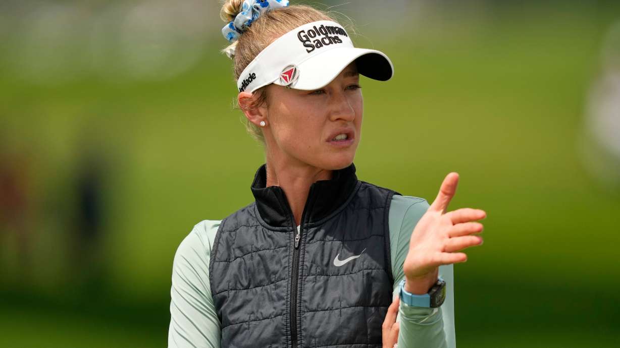 Nelly Korda talks to her caddie on the first hole during the final round of the Women's PGA Championship golf tournament at Hazeltine National Golf Club, Sunday, June 28, 2026, in Chaska, Minn.