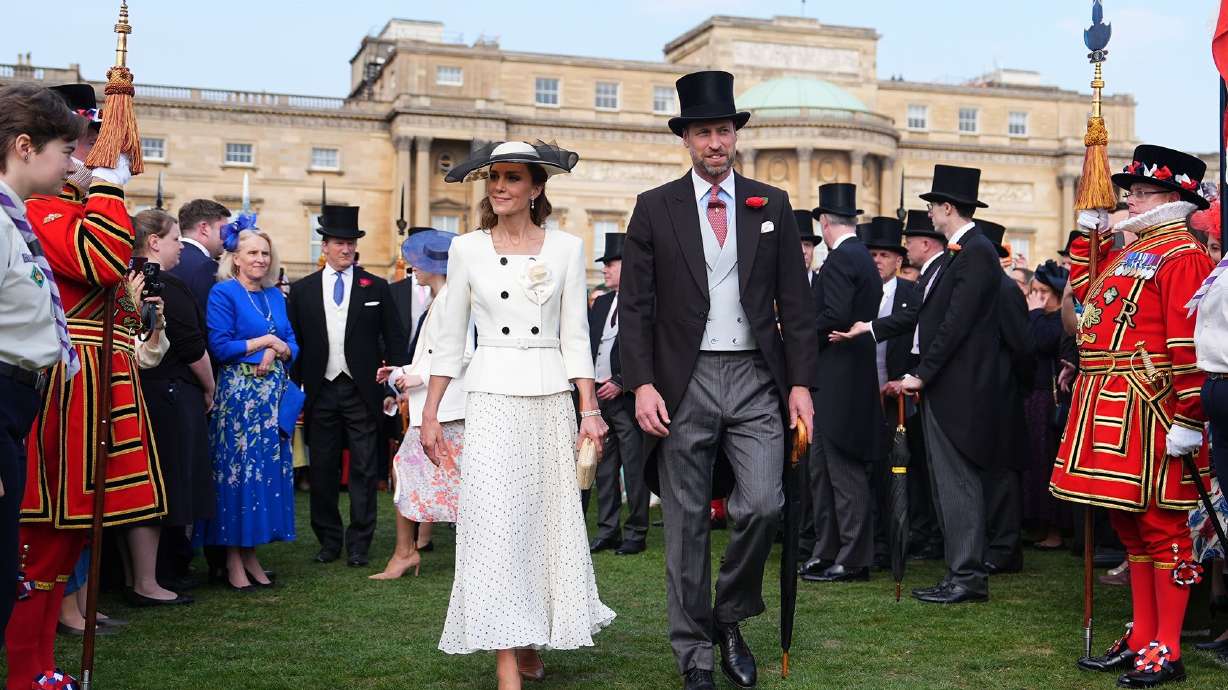 Catherine and William are pictured at a garden party in May.