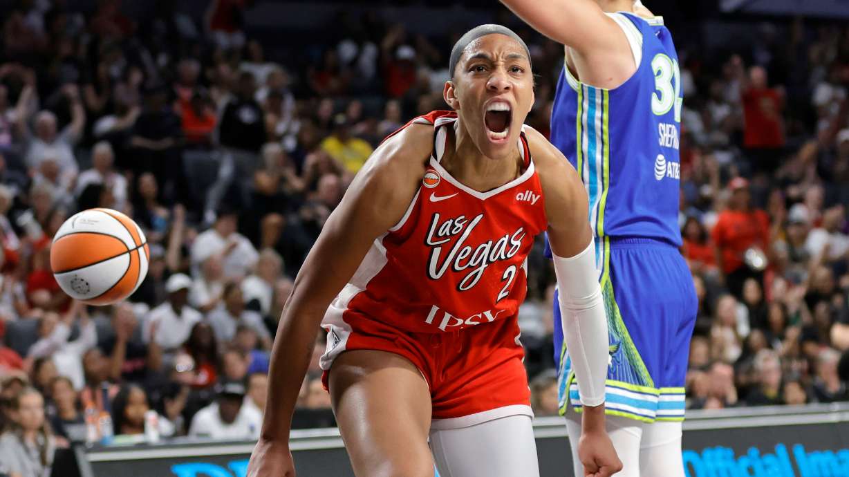Las Vegas Aces center A'ja Wilson, left, reacts after scoring against Dallas Wings forward Jessica Shepard, right, during the first half of a WNBA basketball game Thursday, June 25, 2026, in Las Vegas.