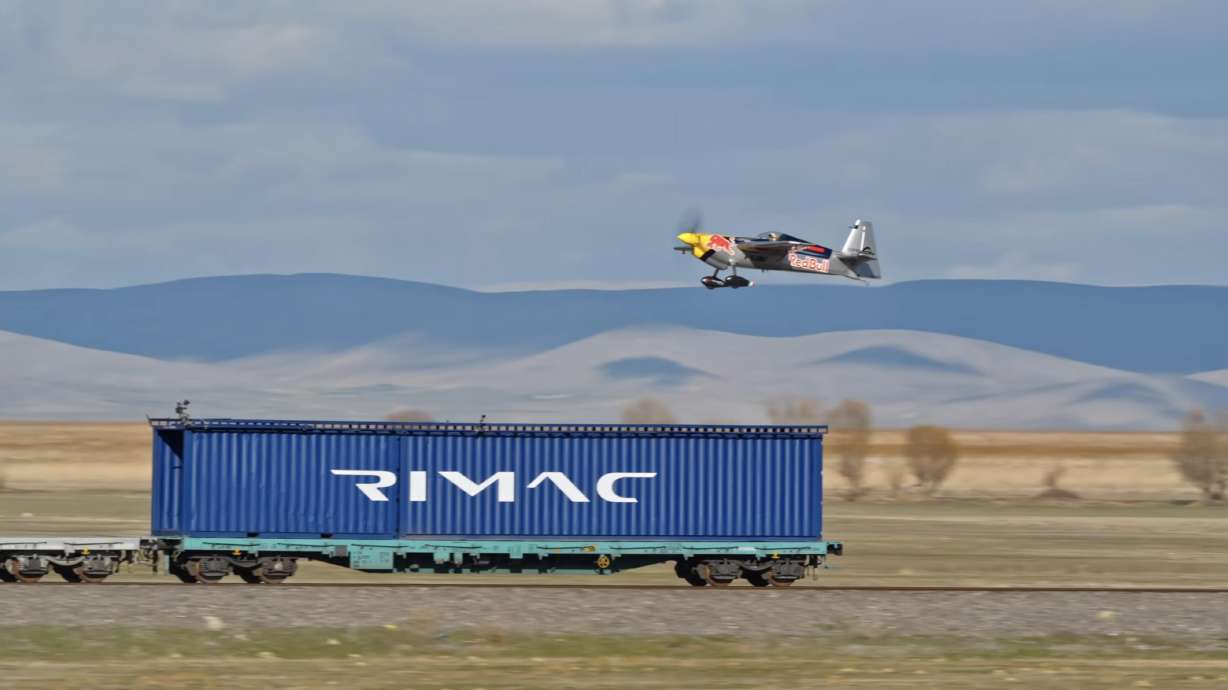 Red Bull athlete and stunt pilot Dario Costa created aviation history by landing his race aircraft on a moving cargo train before lifting off again in a vertical climb.