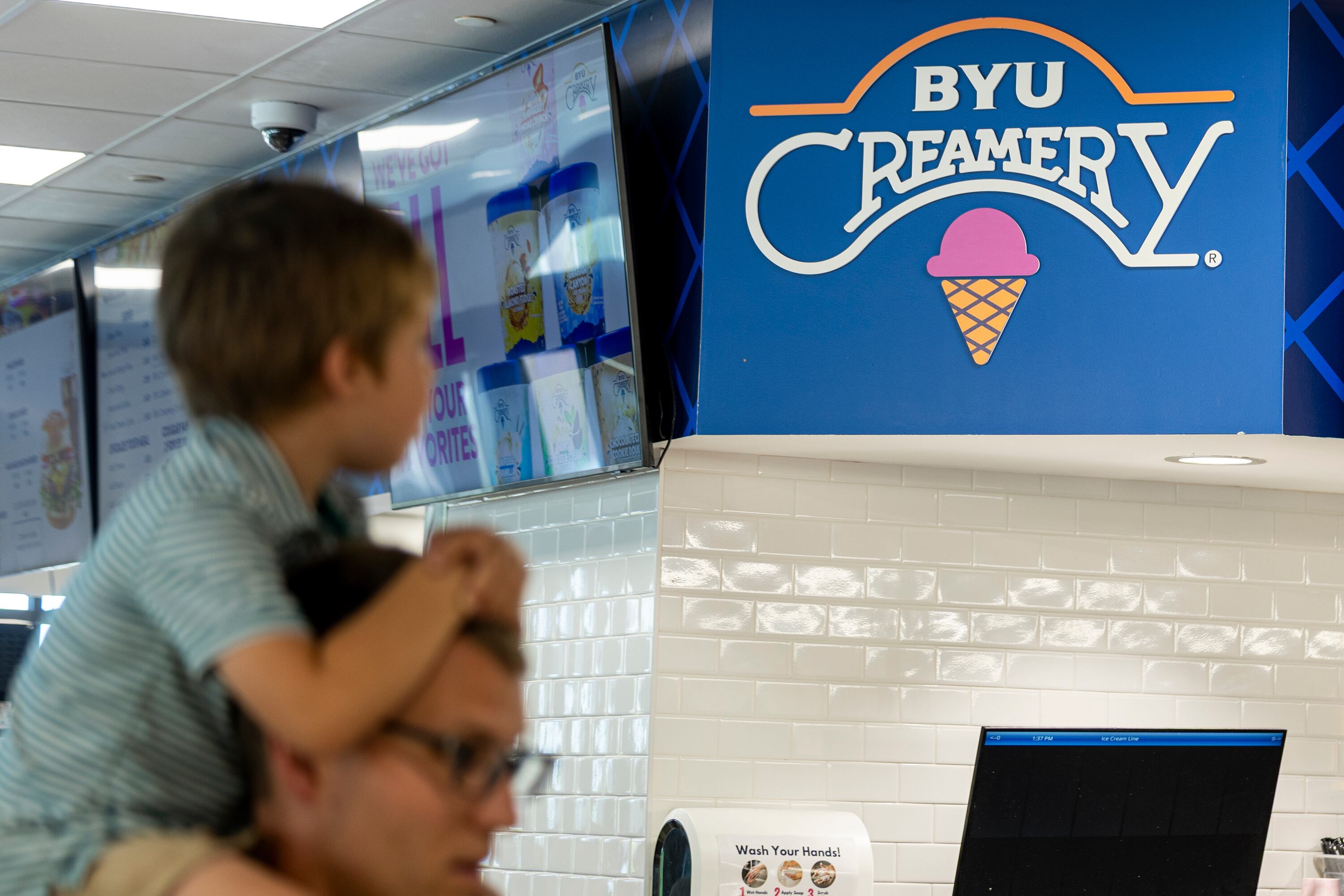 People wait in line for ice cream at the BYU Creamery on Ninth in Provo on June 15.