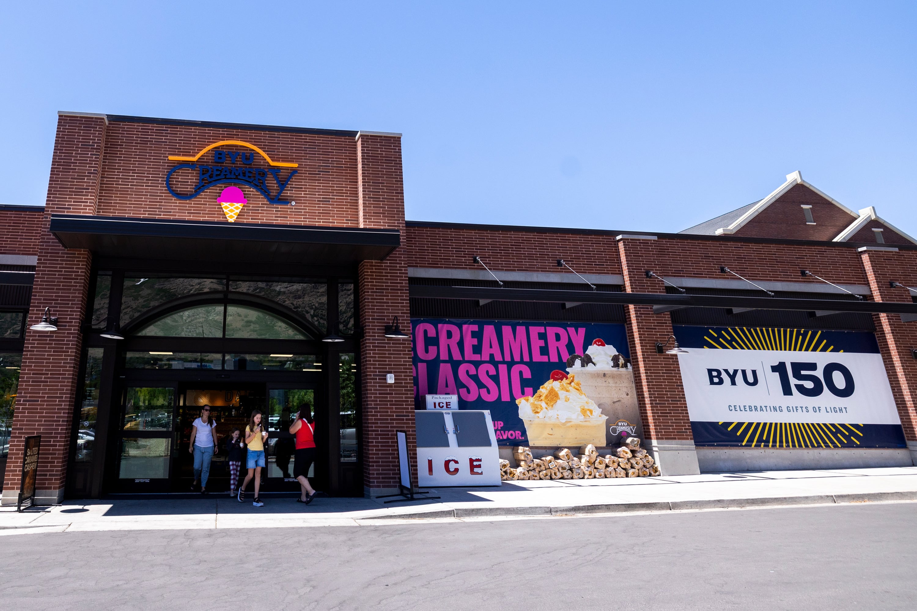 People exit the BYU Creamery on Ninth in Provo on June 15.