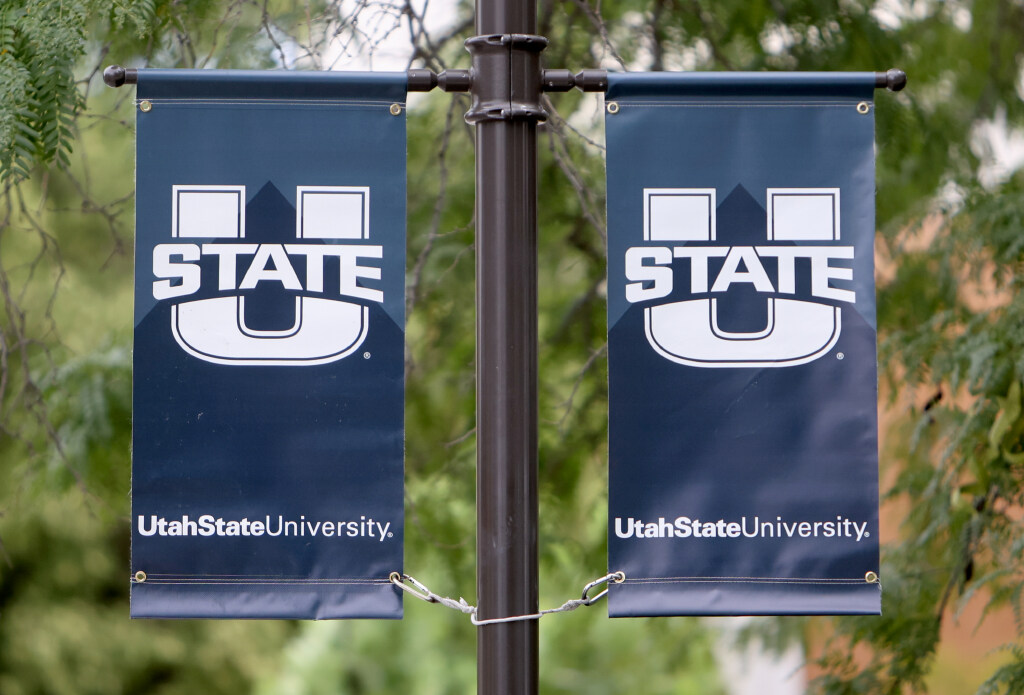 Banners are pictured hanging on the Utah State University campus in Logan on Wednesday, Aug. 14, 2024.