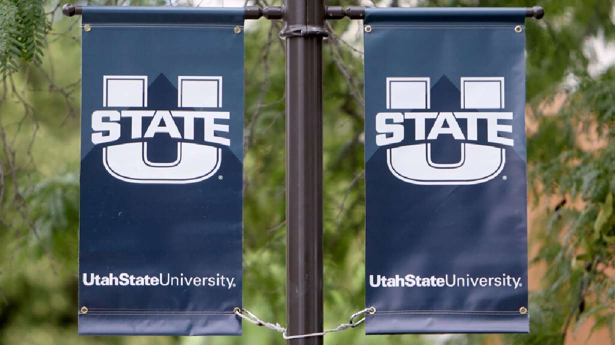 Banners are pictured hanging on the Utah State University campus in Logan on Wednesday, Aug. 14, 2024.