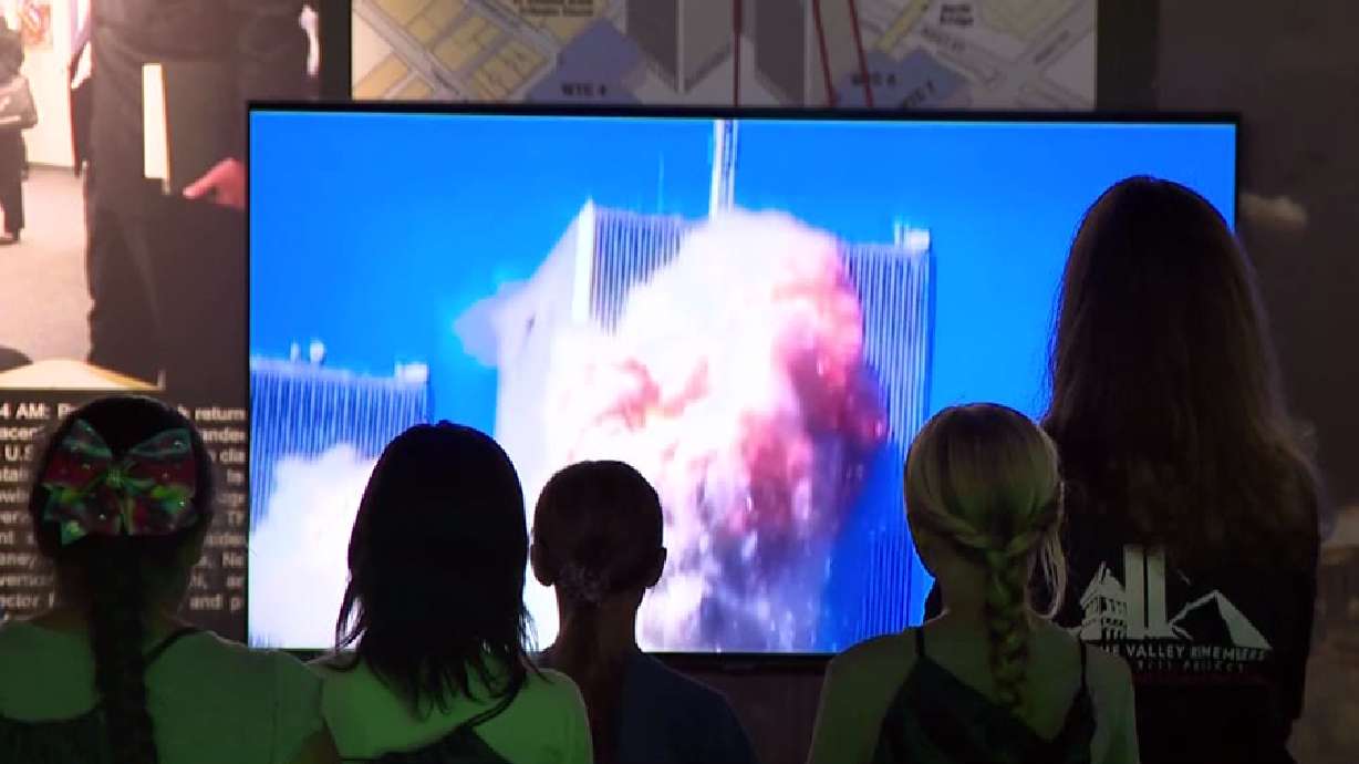 people watch screen of twin towers