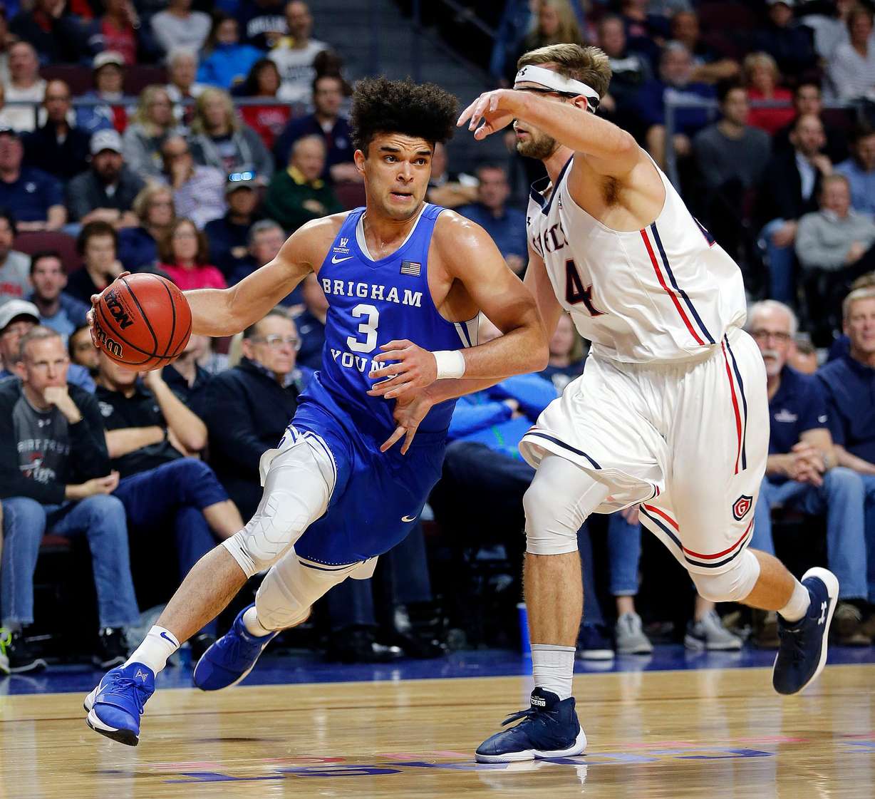 Brigham Young Cougars guard Elijah Bryant drives with St. Mary's Gaels forward Calvin Hermanson defending during the West Coast Conference basketball tournament in Las Vegas on March 5, 2018.