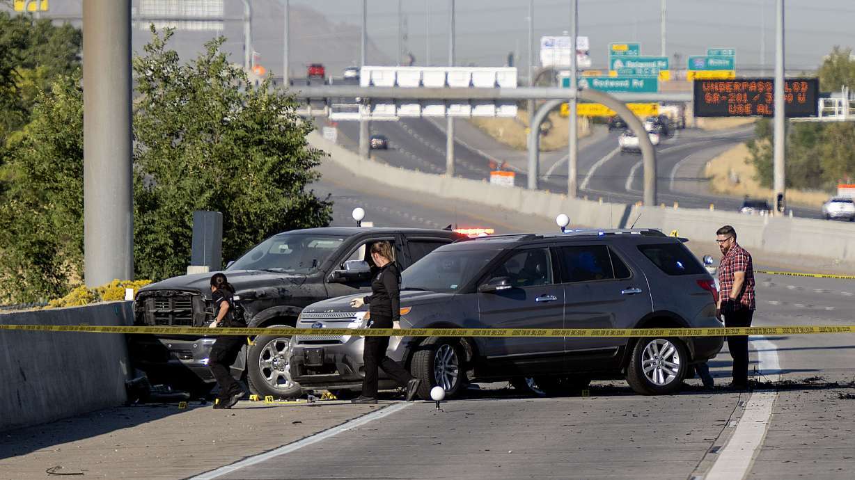 Officers investigate after a fatal road rage shooting on state Route 201 near 1000 West in Salt Lake City on Oct. 7.