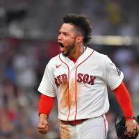 A bat flip, a shout of 'Venezuela' and tears for home as Red Sox 1B Willson Contreras plays on