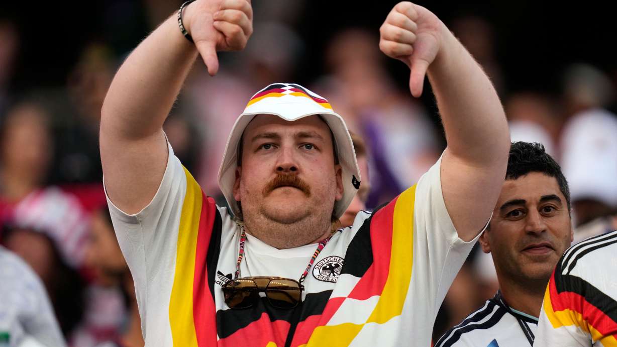 A Germany fan reacts at the end of the World Cup round of 32 soccer match between Germany and Paraguay in Foxborough, Mass., near Boston, Monday, June 29, 2026.