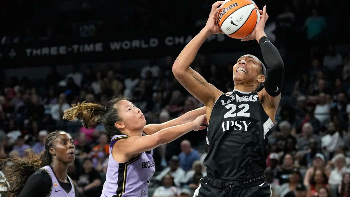 Las Vegas Aces center A'ja Wilson (22) grabs a rebound over Golden State Valkyries guard Kaitlyn Chen (2) during the second half of a WNBA basketball game Sunday, June 21, 2026, in Las Vegas.