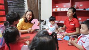 Sheryl Latorre teaches students at her preschool in Manila, Philippines.