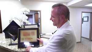 Dr. Eric Ashby shows an example of a certificate you can order online.